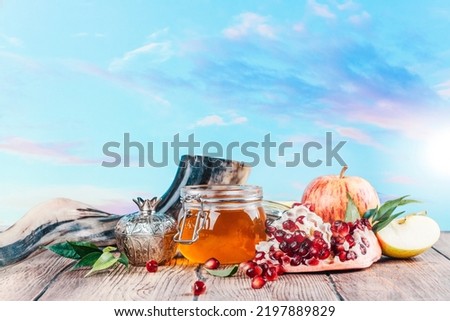 Rosh Hashanah Holiday Background. Rosh hashanah (jewish holiday) concept: honey, apples and pomegranate. Space for text Royalty-Free Stock Photo #2197889829