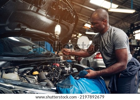 Auto mechanic are repair and maintenance auto engine is problems at car repair shop.	