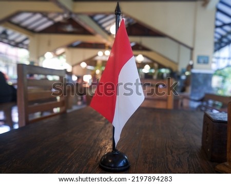 Indonesian pole flag miniature above table in Pendopo 45 Hotel and Resto, Parung, Bogor
