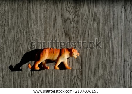 tiger toy on the wooden floor