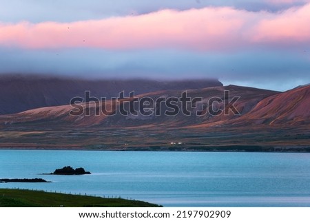Beautiful sunset over mountain range and cloudy on coastline in peninsula on summer at Iceland Royalty-Free Stock Photo #2197902909