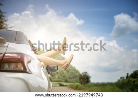 photo of leg woman in car during morning time holiday