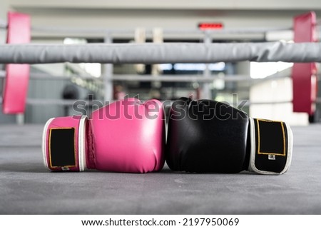 pink and black Boxing glove in punching in woman concept.