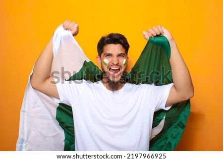 Pakistani, Indian, South Asian cricket fan celebrating victory or showing excitement for cricket