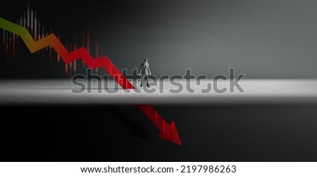 Recession, Inflation and Depression Concepts. Economic Crisis. Graph Fall Down, Business Collapse. a Miniature Figure of Businessman Looking at a Red Graph Arrow Down Royalty-Free Stock Photo #2197986263