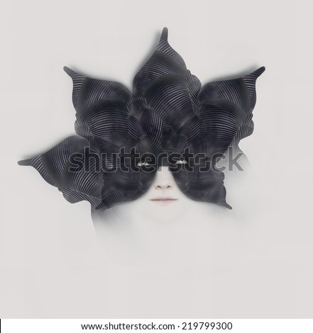 Beautiful surreal artistic portrait of a female with a bizarre black mask-hat shaped with like a flower with petals on white background