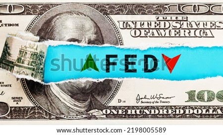 The Federal Reserve FED wording with up and down arrow on USD dollar banknote for Federal reserve increase and decrease interest rate control which effect to America and world economic growth concept. Royalty-Free Stock Photo #2198005589
