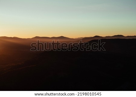 Beautiful mountains view in the morning. Autumn foggy landscape. Sunrise in the Carpathian mountains