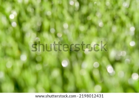 Defocus, blur picture of green artificial turf for background.