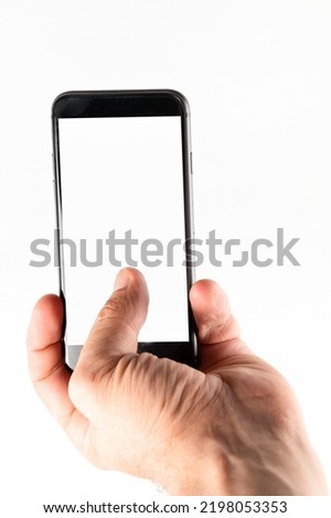 Man hand using smartphone on white background. Closeup shot of man hand holding a smartphone. Vertical image