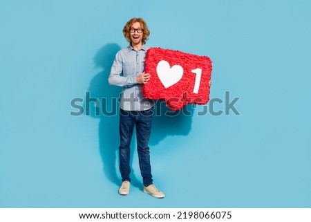 Full size portrait of cheerful funky person hands hold large like collage isolated on blue color background
