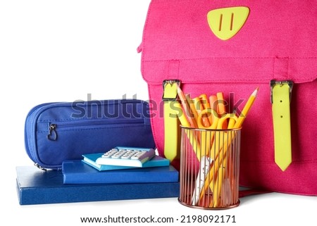 Pen cup with school stationery, pencil case and backpack on white background
