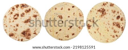 Wheat round taco tortilla or pita lavash round flat bread from above, isolated on white background. Royalty-Free Stock Photo #2198125591