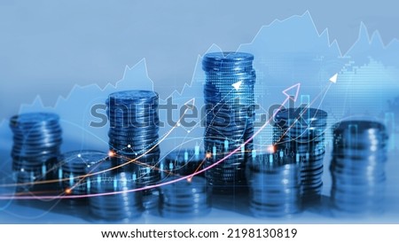 Financial investment and success market stock technology currency report. Stacks of coin with trading graph.  Royalty-Free Stock Photo #2198130819
