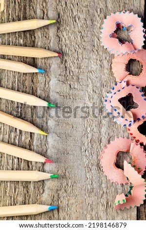 Colorful pencils and sharpening shavings, vertical image, back to school