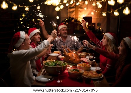 Table of roast turkey and food in christmas and new year party of American family at home, family member enjoy home made turkry grill dining togather in house Royalty-Free Stock Photo #2198147895