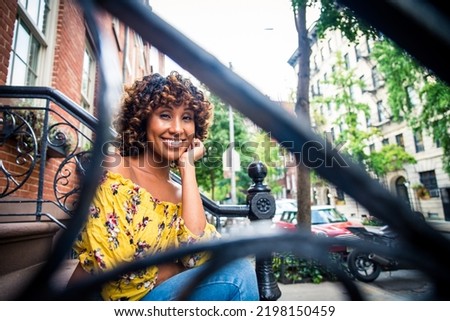 Happy african american woman smiling. Beautiful young femal walking and having fun in New York city