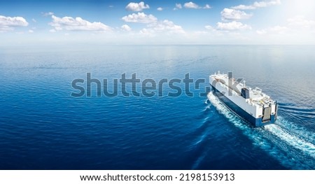 Aerial view of a big car carrier ship RO-RO (Roll on Roll off) cruising in mediterranean sea as a banner with copy pace Royalty-Free Stock Photo #2198153913