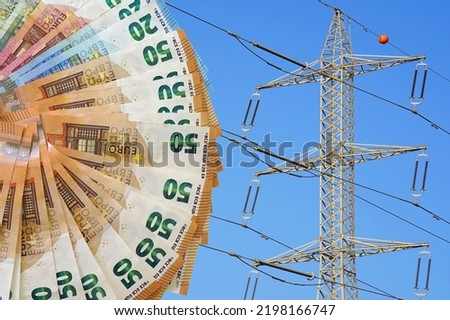 Euro banknotes on electric pole background. Energy crisis in Europe, power shortage and increased energy consumption. Fan of euro banknotes. Electric crisis. High voltage pole on blue sky background Royalty-Free Stock Photo #2198166747