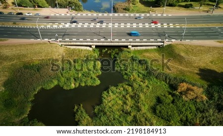 Multi-lane city highway. Overpass across the river. Aerial photography.