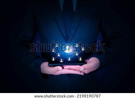 Networking Concept Background with Connecting signs hovering over mobile in hand. Businessman holding smartphone with networking concept