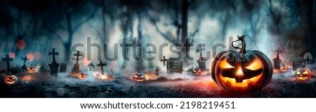 Halloween - Pumpkins In Spooky Forest With Tombs At Night -  Abstract Defocused Background Royalty-Free Stock Photo #2198219451