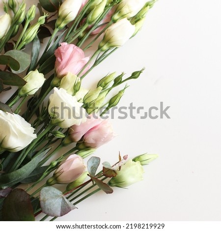a bouquet of flowers in pastel colors on a white background
