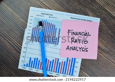 Concept of Financial Ratio Analysis write on sticky notes isolated on Wooden Table. Royalty-Free Stock Photo #2198222917