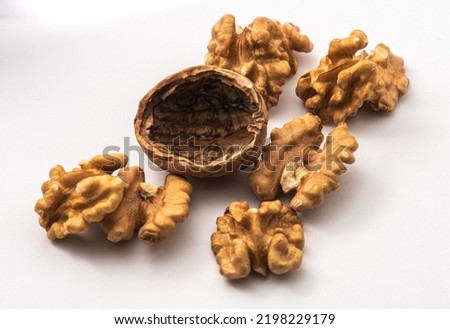 Walnuts isolate. Walnuts peeled on white background. Full depth of field primary nuts.