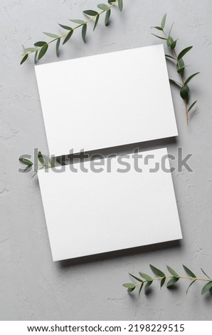 Wedding invitation card mockup with eucalyptus twigs, front and back sides Royalty-Free Stock Photo #2198229515