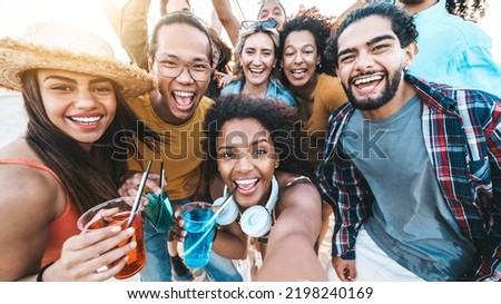 Multiracial group of young people taking selfie on summer vacation - Happy friends hanging outside having fun together - Friendship concept with guys and girls enjoying day out