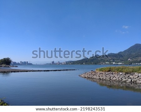 The view of the river with the mountain and sky in Tamsui in New Taipei City in Taiwan