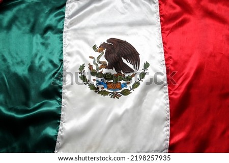 Flag of Mexico one of the Mexican national symbols with the colors green, white, red and a national shield with an eagle devouring a snake to celebrate the independence holidays on September 15 