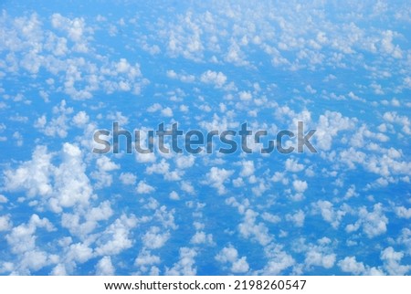 Blue sky fluffy white clouds on summer season bright clear skyline with beautiful cloudscape. Panorama blue sky clouds pattern on daylight with copy space. Cumulus cloudscape air climate sunny day Royalty-Free Stock Photo #2198260547