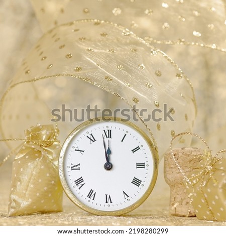 New Year concept, clock near to the midnight of 2023, golden bokeh background