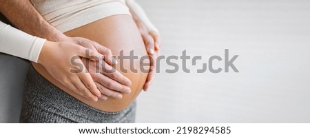 Pregnant woman holding belly with man. Happy expecting family pregnancy banner background. Couple in love.