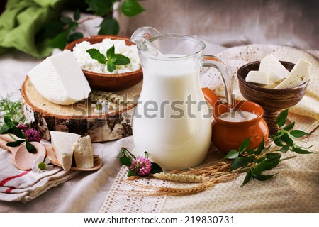 rustic dairy products still life with birch and clover Royalty-Free Stock Photo #219830731