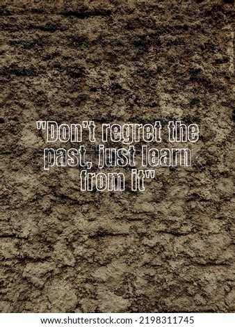 Inspirational quote, "Don’t regret the past, just learn from it", in old tombstone texture background