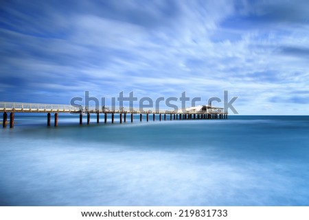Modern steel pier in a cold atmosphere Long exposure photography in Lido Camaiore, Versilia, Tuscany, Italy, Europe