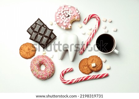 Concept of food bad for teeth on light background Royalty-Free Stock Photo #2198319731