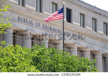 American Flag Waving in the Wind in front of the Bureau of Engraving and Printing - Washington, DC (USA)