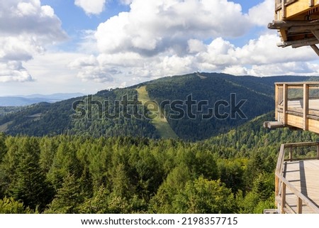 View of Jaworzyna Krynicka from top of wooden observation tower located at the top of the Slotwiny Arena ski station, leading in the treetops, Krynica Zdroj, Beskid Mountains, Slotwiny, Poland  Royalty-Free Stock Photo #2198357715