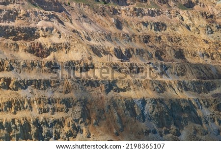 The Berkeley Pit, a former open pit copper mine located in Butte, Montana, is currently one of the largest Superfund sites that is filled with water that is heavily acidic. Royalty-Free Stock Photo #2198365107