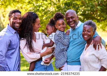 Portrait Of Multi-Generation Family Enjoying Walk In Countryside Together Royalty-Free Stock Photo #2198374235