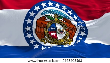 The US state flag of Missouri waving in the wind. Missouri is a state in the Midwestern region of the United States. Democracy and independence. Royalty-Free Stock Photo #2198405563