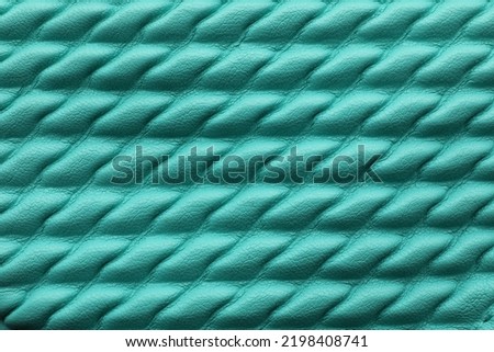 Texture of turquoise leather as background, closeup
