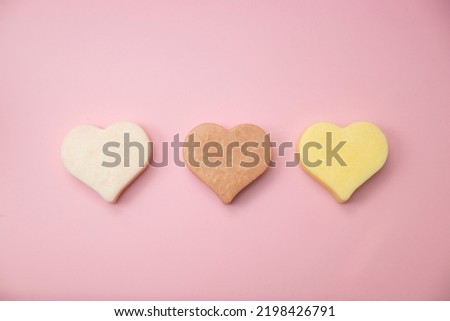 Heart shaped pink bar of soap on a light pink background. Top view, copy space. Heart shaped soaps. Importance of personal hygiene care. Copy space Royalty-Free Stock Photo #2198426791