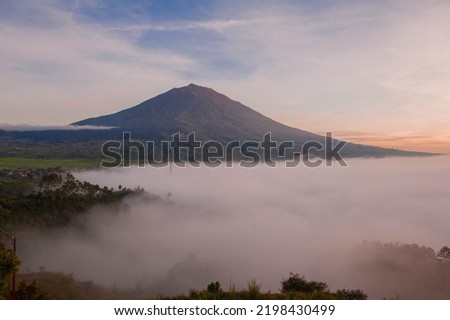 
Mount Kerinci is the highest mountain on the island of Sumatra and the highest volcano in Indonesia. Mount Kerinci is located on the border of Kerinci Regency, with an altitude of 3,805 masl. Royalty-Free Stock Photo #2198430499