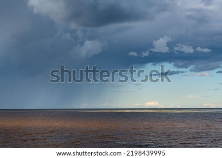A rain cloud with rain on the horizon. Background picture.