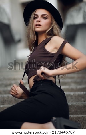 Closeup fashion woman portrait of young pretty trendy girl posing in city Royalty-Free Stock Photo #2198446707